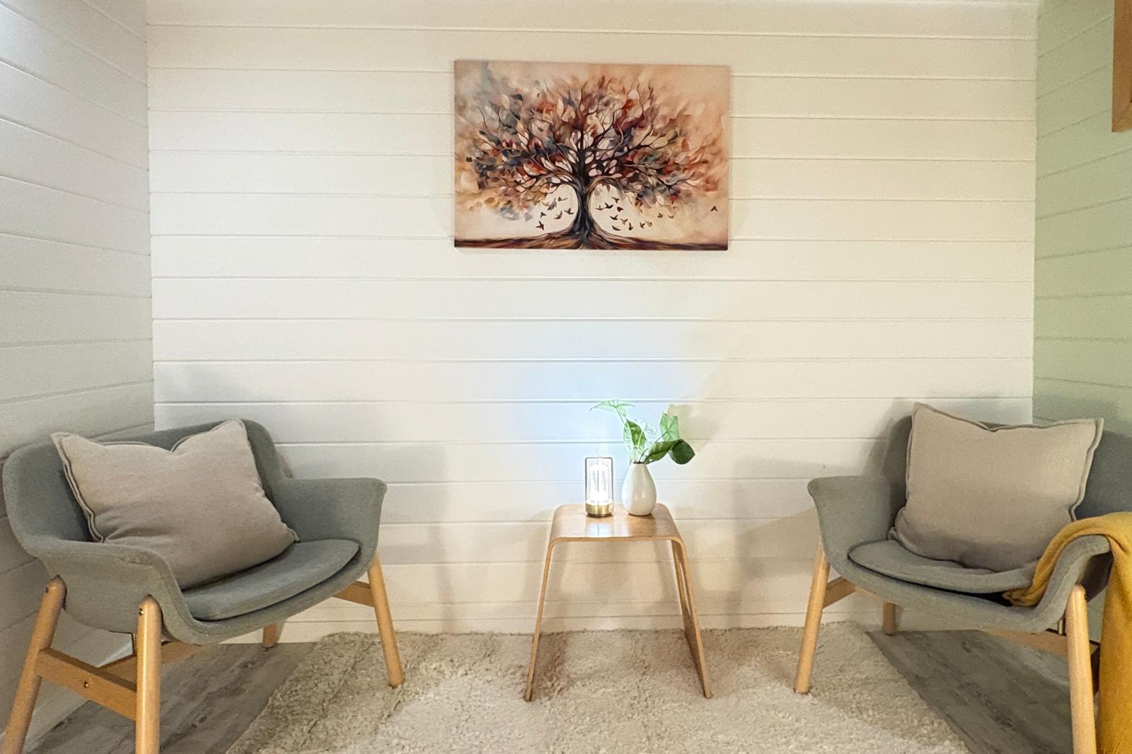 Cabin seating area with tree of life artwork